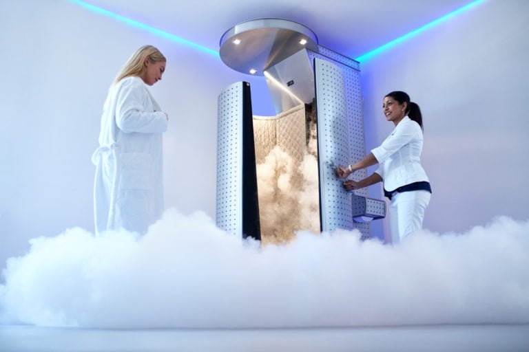 Portrait of woman going for cryotherapy treatment in cryosauna booth.