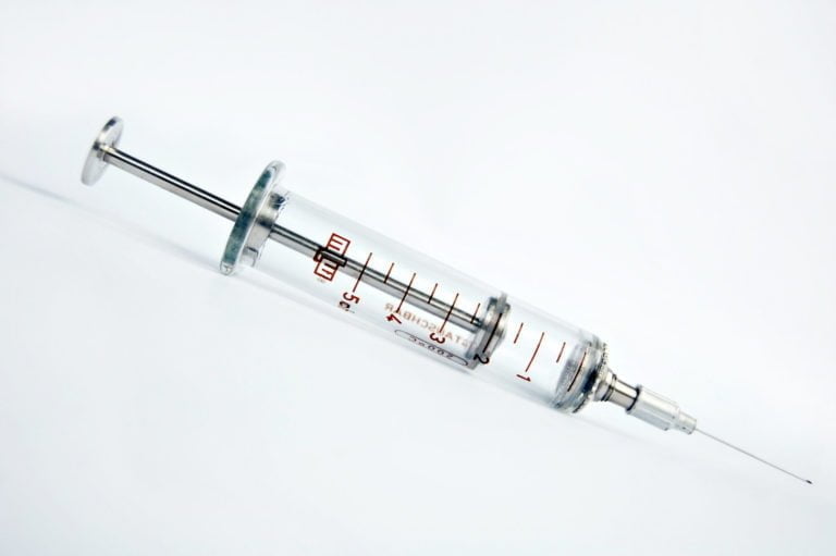 Hypodermic needle on white background. ampula; anesthetic; antidote;